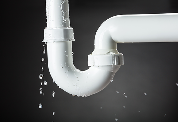 Leaking white plastic pipe joint