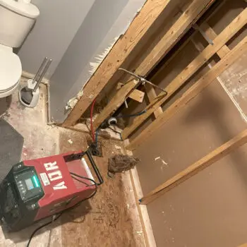 Bathroom plumbing repair in progress